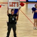 M Brock with Orange Cheerleaders 2-24